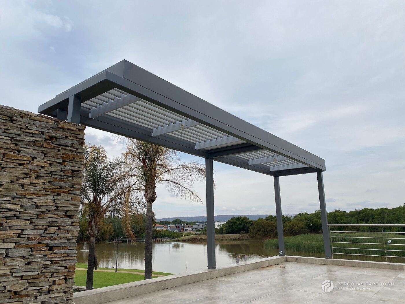 Aluminium louvre pergola over an estate terrace, Western Cape