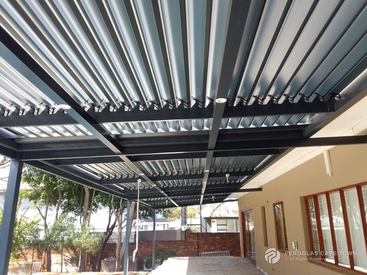 Charcoal louvre roof over a City Bowl patio, Cape Town