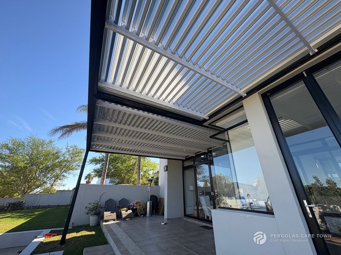 Charcoal steel structure and gutter system white internal louvres
