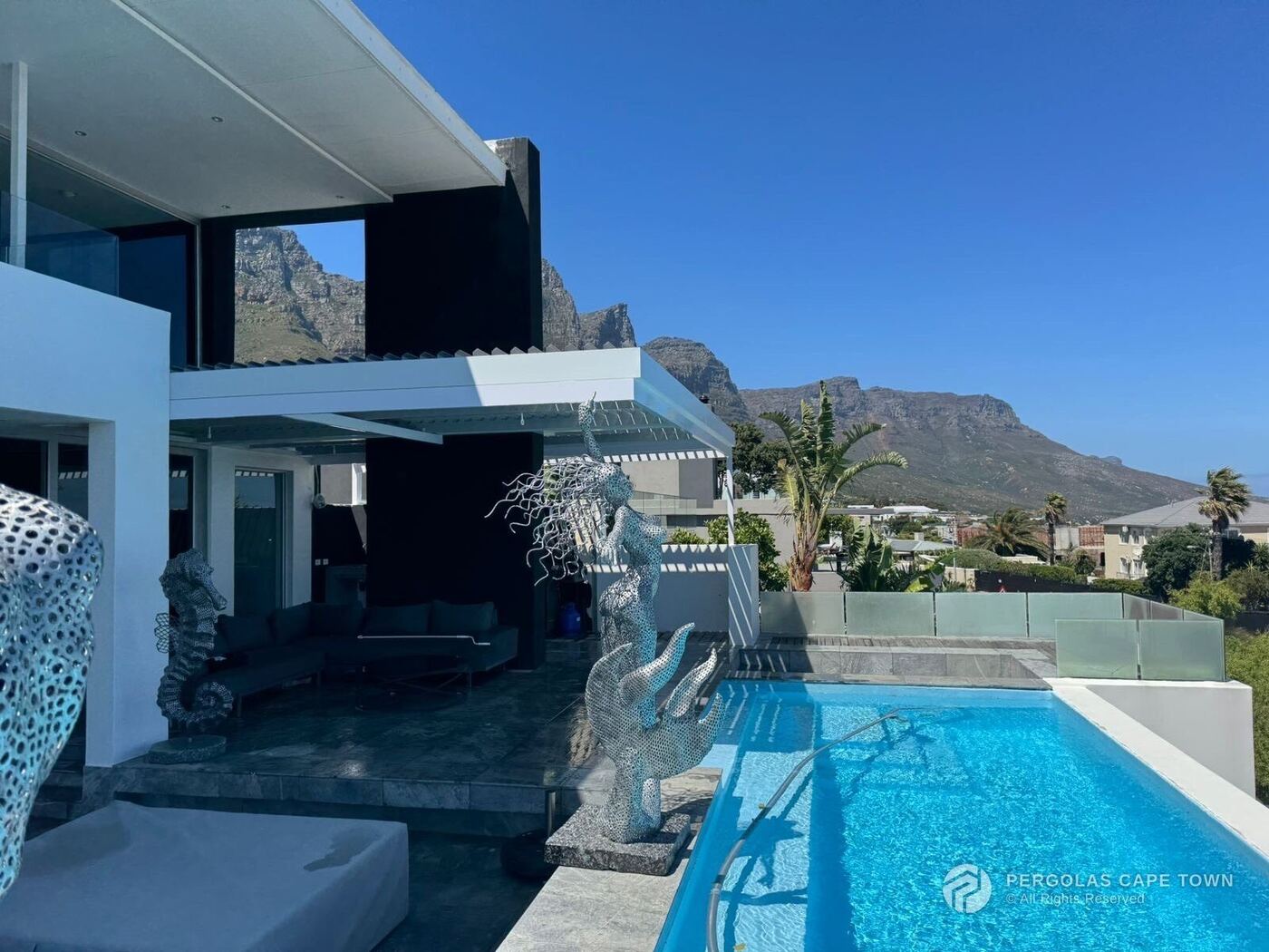 Dove grey cantilevered louvre roof camps bay