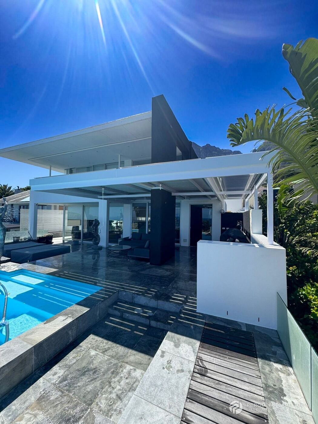 Dove grey cantilevered louvre roof camps bay