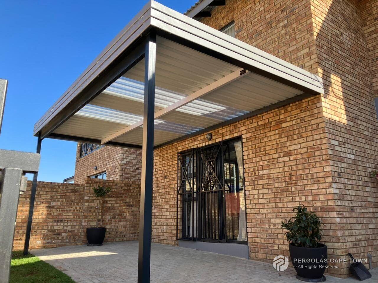 Fixed aluminium awning with polycarbonate skylight inserts