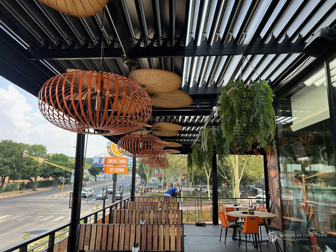 Restaurant patio cover with pendant lighting